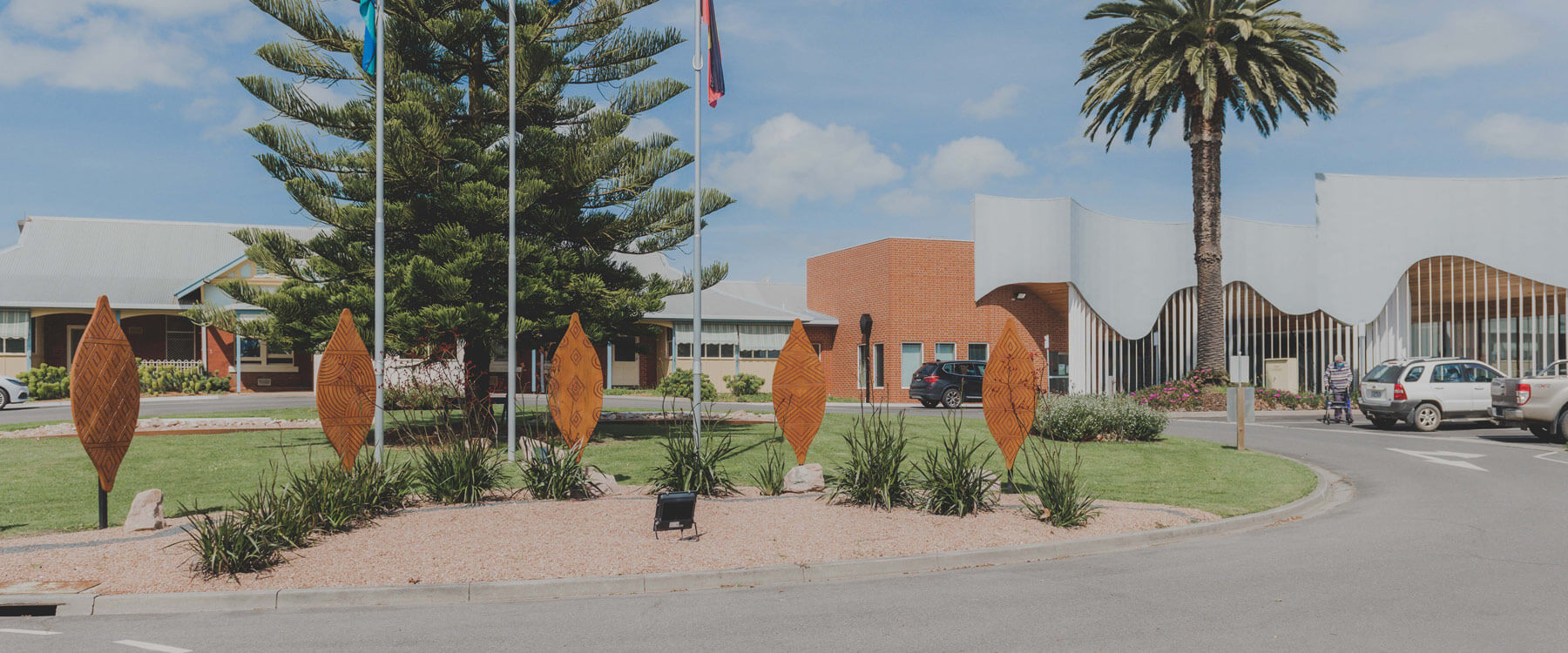 Photo of five aboriginal shield artworks in the entry gardens at Yarram District Health Service