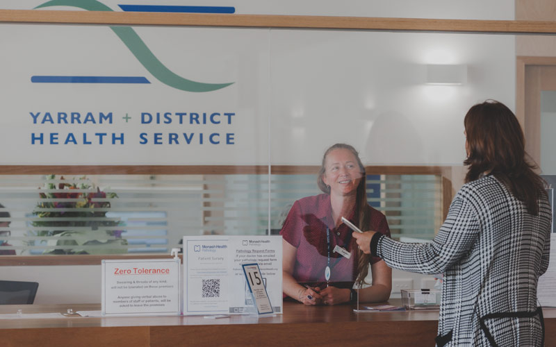 Photo of reception desk staff and client at Yarram Medical Centre